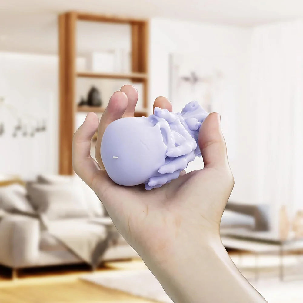 Bougie Décorative Crâne Tenu par une Main et Petits Crânes